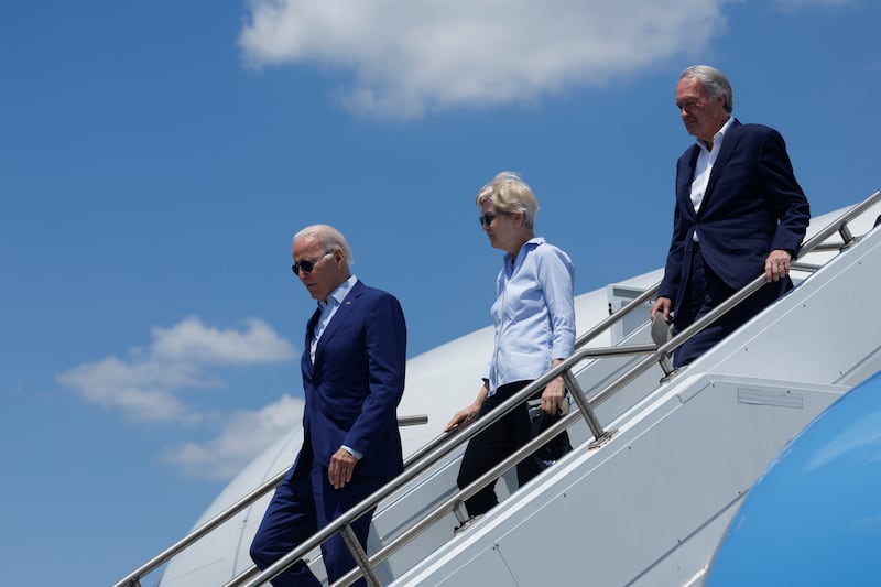 The president arrives with senators Elizabeth Warren and Ed Markey aboard Air Force One. Reuters