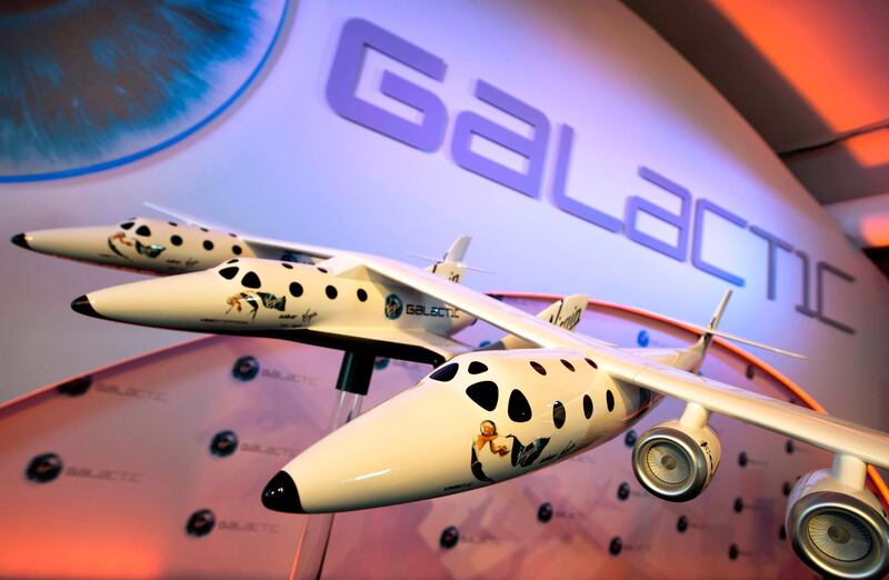 (FILES): This July 11, 2012 file photo shows a model of the Virgin Galactic, the world’s first commercial spaceline, displayed at the Farnborough International Airshow in Hampshire, southern England.  The two companies leading the pack in the pursuit of space tourism say they are just months away from their first out-of-this-world passenger flights -- though neither has set a firm date. Virgin Galactic, founded by British billionaire Richard Branson, and Blue Origin, by Amazon creator Jeff Bezos, are racing to be the first to finish their tests -- with both companies using radically different technology.
 / AFP / Adrian DENNIS / With AFP Story by Ivan COURONNE: First space tourist flights could come in 2019 
