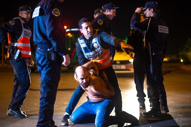 Moroccan police arrest a man who refuses to follow confinement measures in place as part of a state of emergency to combat the spread of coronavirus, Casablanca.  AFP