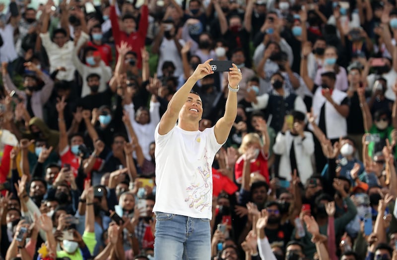 Ronaldo takes a selfie with fans at Expo 2020 Dubai's  Health and Wellness Week at Al Wasl Plaza.