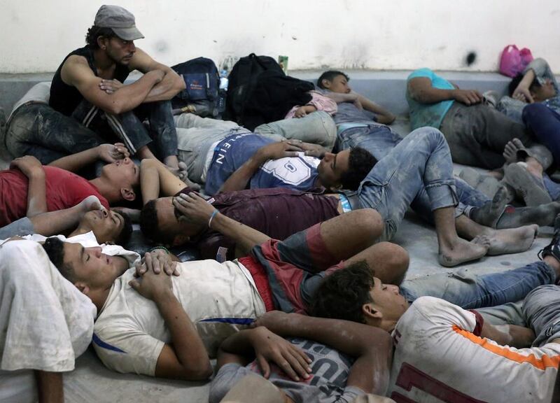 Migrants who were rescued from a boat that capsized in the Mediterranean Sea rest in Al Beheira, Egypt, on September 22, 2016. Mohamed Abd El Ghany / Reuters