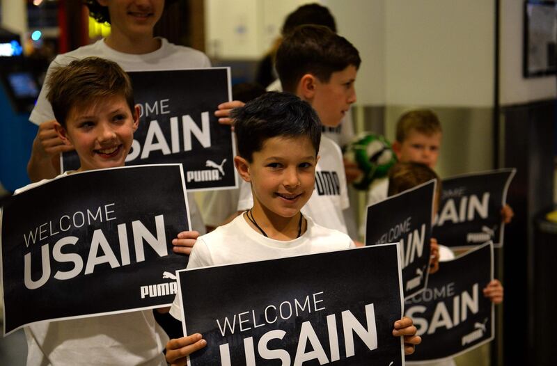 Kids welcome Usain Bolt at the Sydney international airport. AFP