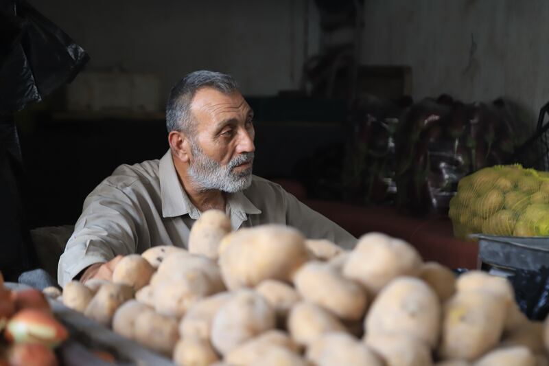 A 60-year-old man sells vegetables with no face mask. Abd Almajed Alkarh for The National