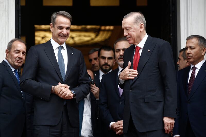 Turkish President Recep Tayyip Erdogan gestures next to Greek Prime Minister Kyriakos Mitsotakis after their meeting at Maximos Mansion in Athens, Greece, on Thursday. EPA