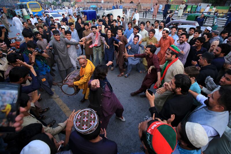 Supporters of former Pakistani prime minister Imran Khan celebrate in Peshawar after the country's Supreme Court ordered his release. EPA