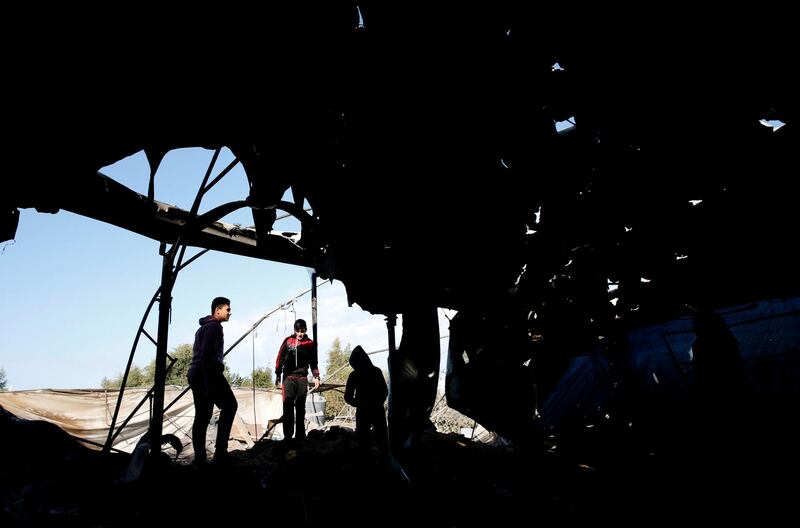 Palestinians inspect a mosque that was damaged in a nearby Israeli air strike in Gaza. Reuters