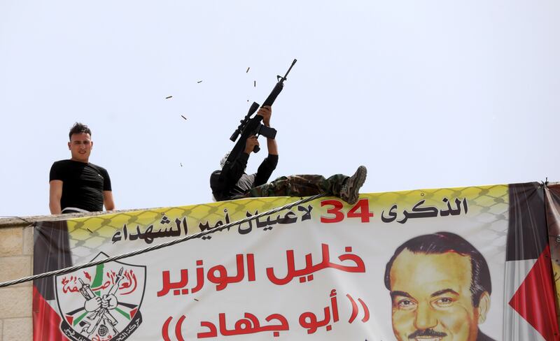 Palestinian militants fire a salute during the funeral of Yahya Adwan in Azzun. EPA