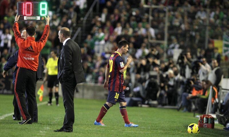 Lione Messi is likely to be out six to eight weeks after injuring his left hamstring. Angel Fernandez / AP