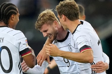 Germany's Timo Werner is celebrated after he scored his side's 5th goal during the UEFA Nations League soccer match between Germany and Italy in Moenchengladbach, Germany, Tuesday, June 14, 2022.  (AP Photo / Martin Meissner)