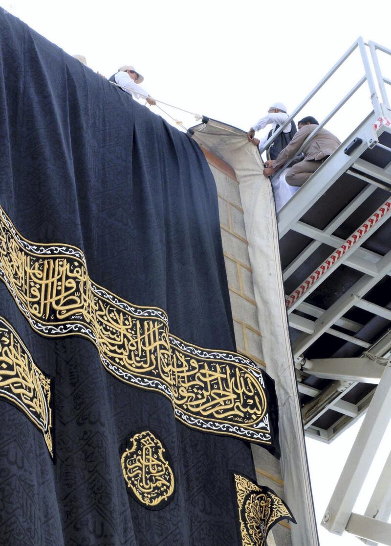 The Kaaba's kiswah is replaced. Saudi Press Agency