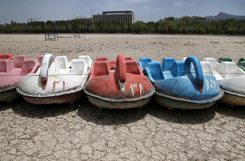 A row of paddle boats sit on the parched Zayandeh Roud riverbed, in Isfahan, on July 10, 2018. AP Photo