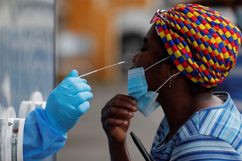 Medical personnel from the Ministry of Health of Panama performs a nasal swab tests to detect Covid-19 disease at a medical post in the district of San Miguelito in Panama City, Panama. EPA