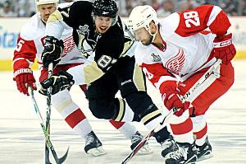 Detroit's Brian Rafalski, right, in action against the Penguins.