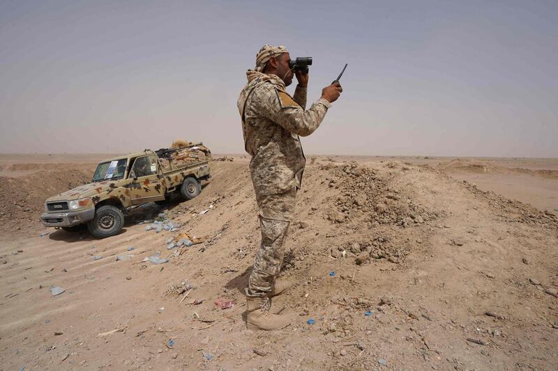 Fighters with forces loyal to Yemen's internationally recognised government hold a position against Houthi rebels in Yemen's northeastern province of Marib. AFP