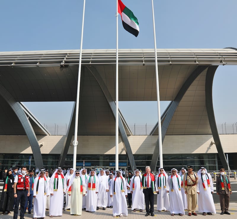 Sheikh Ahmed hoists UAE flag at a special ceremony at Dubai International Airport Terminal 3. Photo: Dubai Media Office