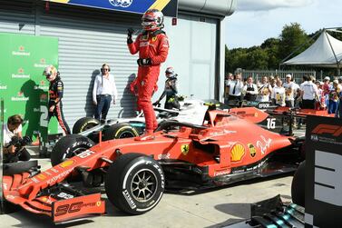 Charles Leclerc celebrates atop his Ferrari after winning the Italian Grand Prix. Reuters