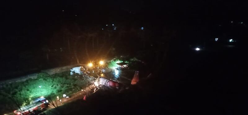 Indian news agency ANI shared these images from the crash site, which showed the Air India Express plane split in two close to Kozhikode-Calicut International Airport. ANI 