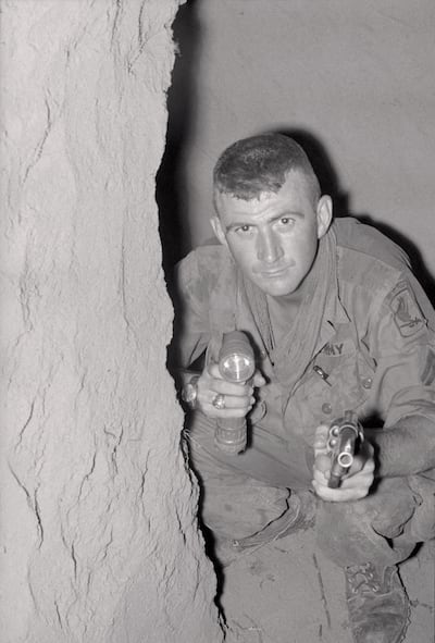 Cpl Charles Patchin, 23, a member of the 173rd Airborne Brigade, searching a Viet Cong tunnel. Photo: Bettmann Archive