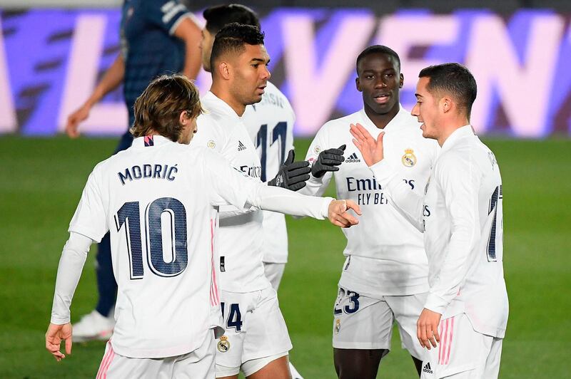 Real Madrid forward Lucas Vazquez, right, celebrates with teammates after scoring the opening goal in their 2-0 La Liga win against Celta Vigo at the Alfredo Di Stefano Stadium on January 2. AFP