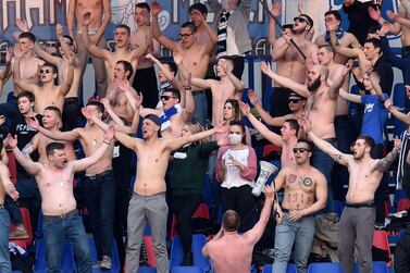 Fans of FC Minsk support their team during the Belarus Championship match between FC Minsk and FC Dinamo-Minsk. AFP