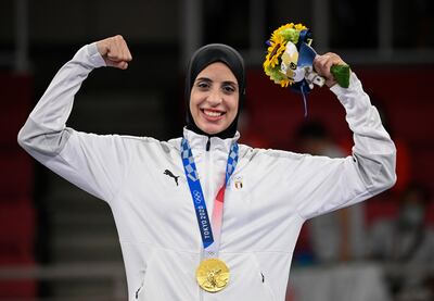 Egypt's Feryal Abdelaziz poses with her gold medal in the women's kumite +61kg in the karate competition at a ceremony during the Tokyo 2020 Olympic Games. AFP