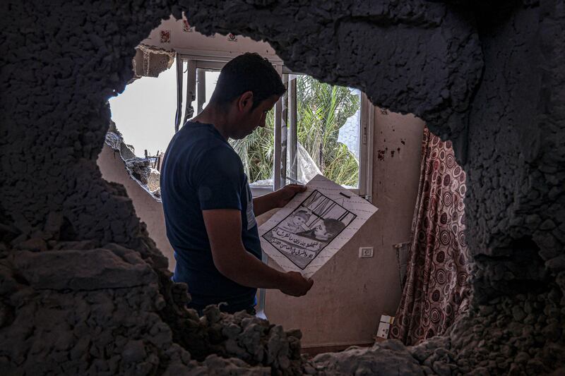 The artist's brother with one of her sketches. AFP