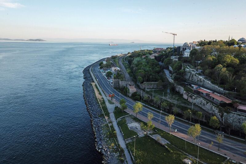 An empty road leading to Eminonu near Bosphorus strait, in Istanbul, during a two-day curfew to prevent the spread of the COVID-19 disease, caused by the novel coronavirus.    AFP