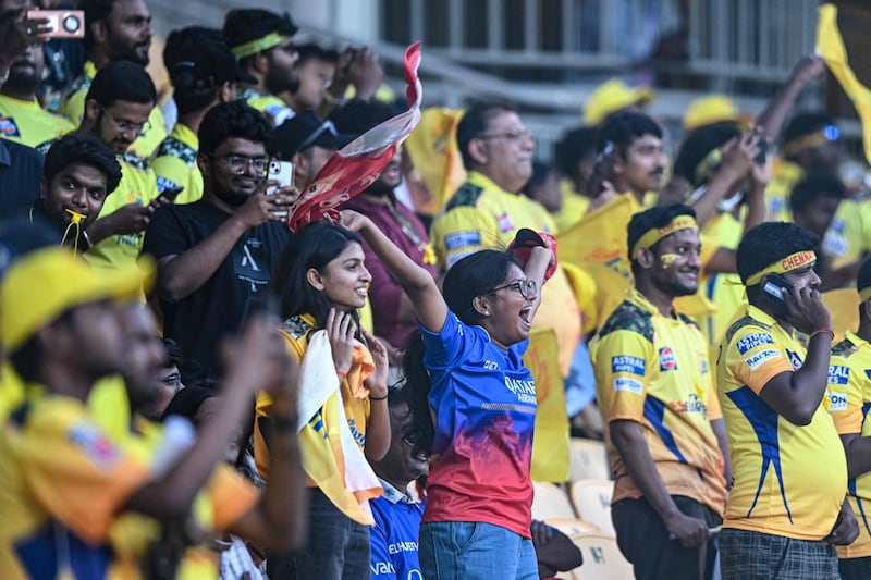 Fans cheer before the start of the Indian Premier League match between Chennai Super Kings and Royal Challengers Bangalore. AFP