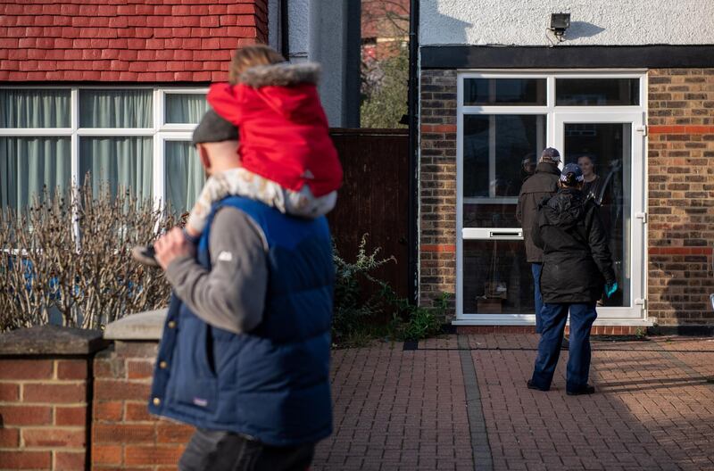 Police conduct door to door enquiries and searches along Atkins Road in London. Getty Images