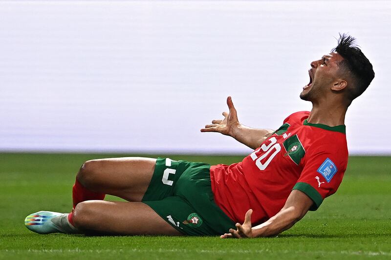 Morocco's  Achraf Dari celebrates after levelling at 1-1. AFP