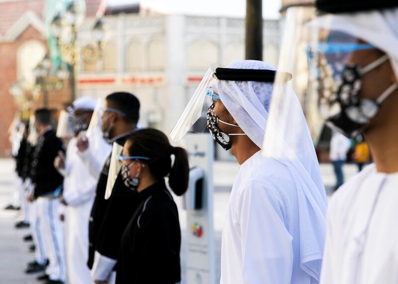 DUBAI, UNITED ARAB EMIRATES. 25 OCTOBER 2020. 
Checkers line up at the entrance of Global Village. GV celebrates it’s 25th season this year.
(Photo: Reem Mohammed/The National)

Reporter:
Section: