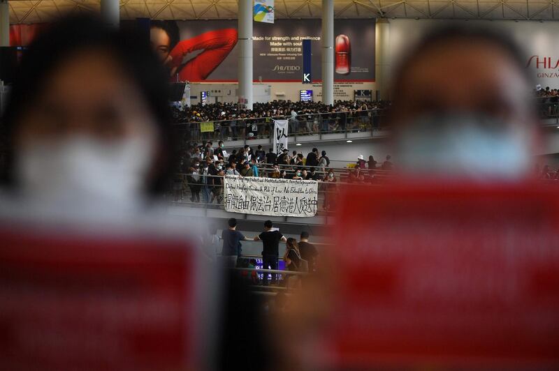 Pro-democracy protesters gather against the police brutality and the controversial extradition bill at Hong Kong's international airport.  AFP