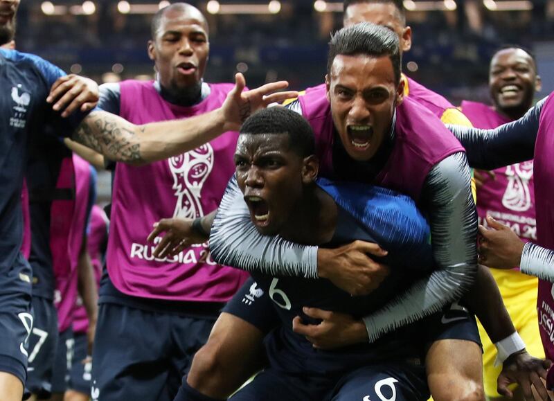 Pogba celebrates scoring their third goal in the 4-2 win with Corentin Tolisso and teammates. Reuters