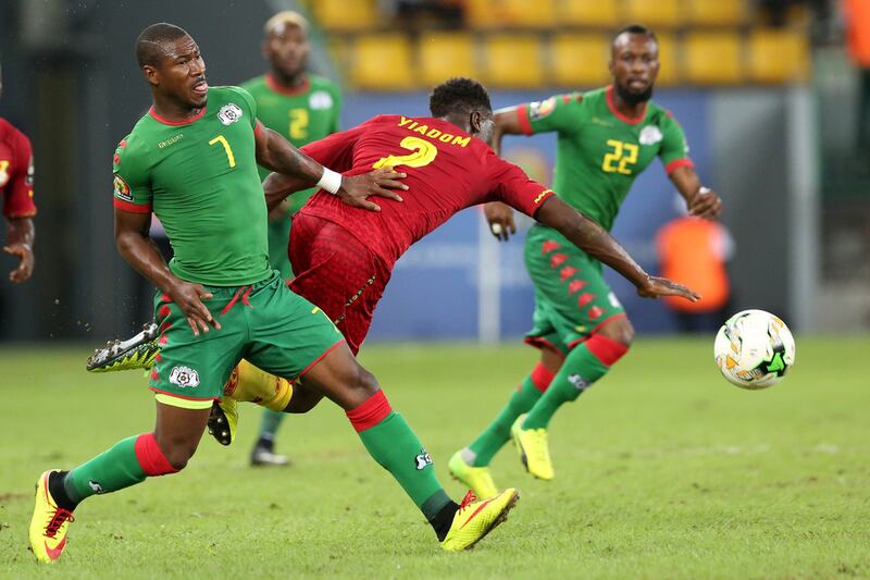 Burkina Faso's midfielder Prejuce Nakoulma, left. Steve Jordan / AFP