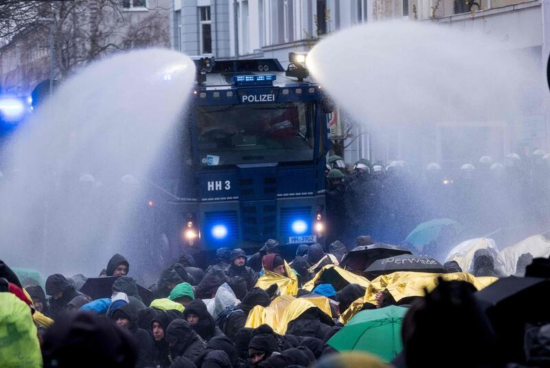 Police use water cannons to remove demonstrators protesting against the Alternative for Germany (AfD) far-right party in Hanover, northern Germany.
Peter Steffen / AFP