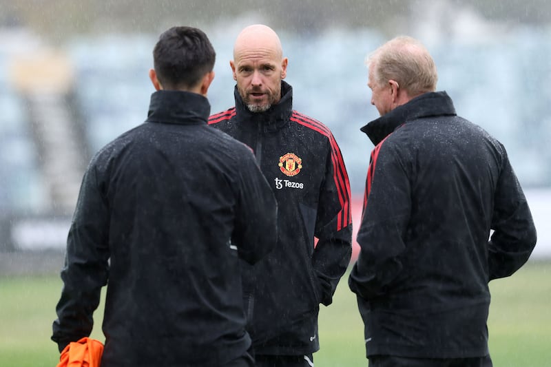 Manchester United manager Erik ten Hag talks to colleagues during a training session in Perth. AFP