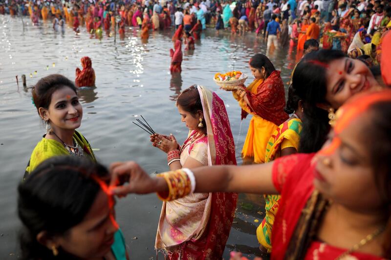 Indian Hindu devotees pray in a holy pond during the Chhath festival in Kolkata, eastern India. EPA