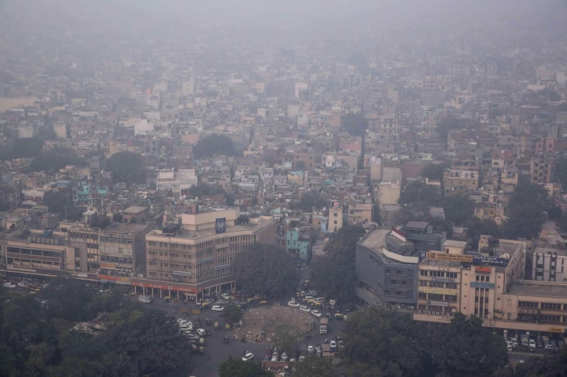This aerial photograph shows heavy pollution smog covering the capital city of Delhi. AFP