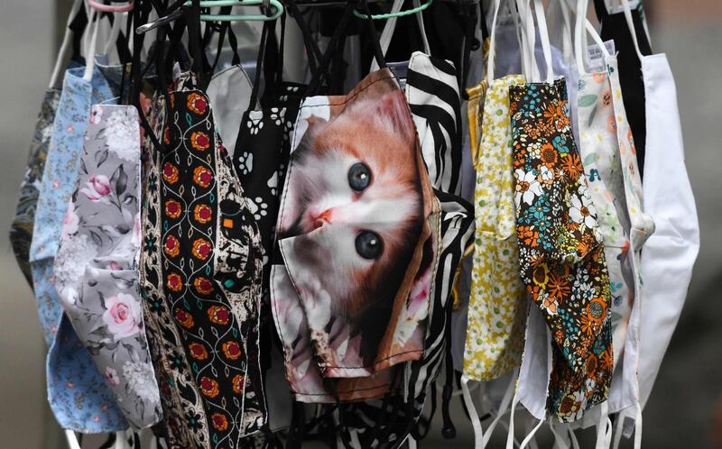 Colourful face masks are on sale in a shop in the pedestrian area in the city of Dortmund, western Germany. In Dortmund, wearing a mask is mandatory in the pedestrian zone since October 13 as a measure to curb the spread of the coronavirus. AFP