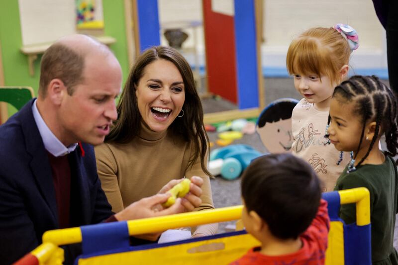 Britain's Prince William, Prince of Wales and Britain's Catherine, Princess of Wales play with children in Scarborough. AFP