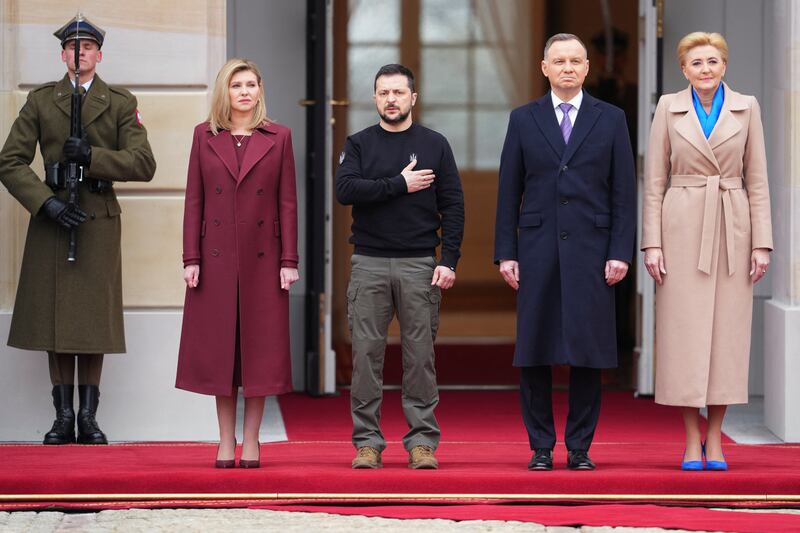 Poland's President Andrzej Duda and Polish first lady Agata Kornhauser-Duda, second right and far right, with Ukrainian President Zelenskyy and his wife Olena Zelenska at the Presidential Palace in Warsaw.  Reuters
