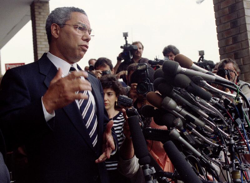 Powell talks to reporters as he embarks on a 26-city tour to promote his book in September 1995. Reuters