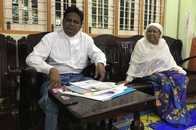 Rohingya candidate Abdul Rasheed sits next to his mother during an interview with Reuters at his home in Yangon, Myanmar, after his application to run as a candidate from Sittwe constituency was rejected with union election commission claiming his parents were not Myanmar citizens by the time he was born, August 22, 2020. Picture taken August 22, 2020. REUTERS/Shoon Naing NO RESALES. NO ARCHIVES