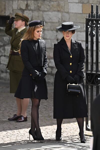 Princess Beatrice and Princess Eugenie leave Westminster Abbey after the state funeral of Queen Elizabeth II. AFP 