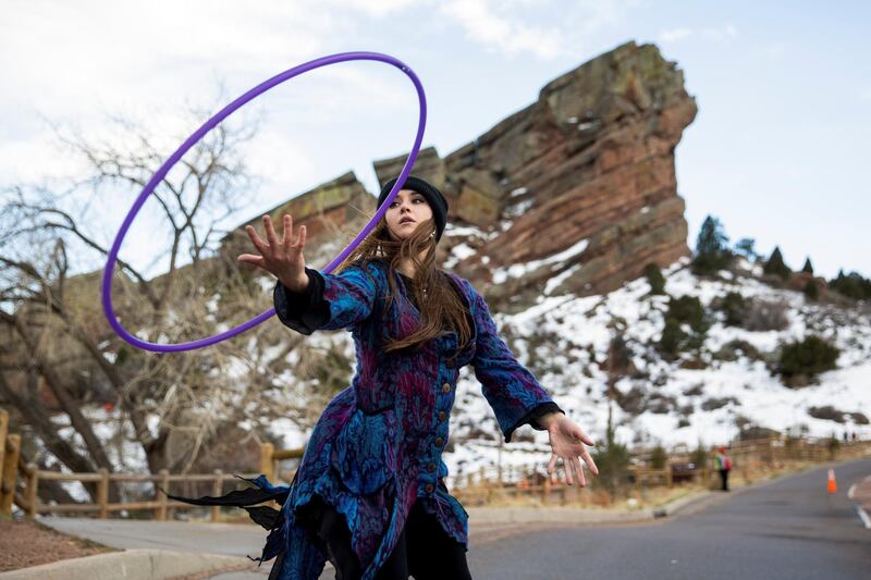 Rachel Irwin hoops in the parking lot before the opening night of Red Rocks Amphitheatre as coronavirus disease (COVID-19) restrictions are eased with a capacity of 2,500 people in Morrison, Colorado, U.S. REUTERS