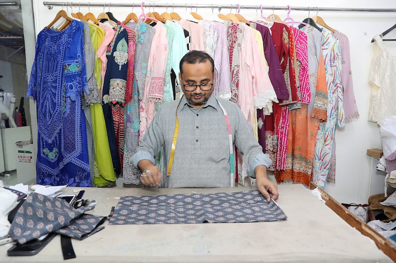 A tailor specialising in women's wear at his shop in Bur Dubai. Pawan Singh / The National