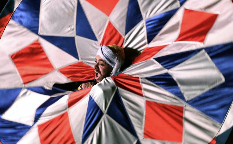 Egyptian dancers spin tanoura skirts during Ramadan Festival at Al Ghoury Palace in Cairo, Egypt. EPA