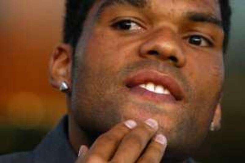 LIVERPOOL, ENGLAND - AUGUST 20:  Joleon Lescott of Everton watches from the stands during the UEFA Europa League Play off first leg match between Everton and SK Sigma Olomouc at Goodison Park on August 20, 2009 in Liverpool, England.  (Photo by Jamie McDonald/Getty Images)