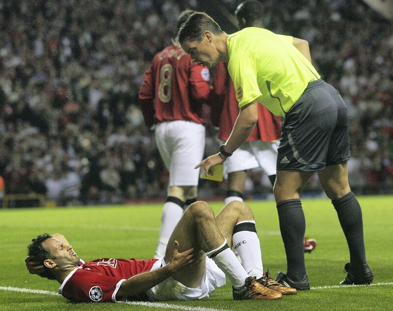 MANCHESTER, ENGLAND - SEPTEMBER 13: Ryan Giggs of Manchester United lies injured during the UEFA Champions League match between Manchester United and Celtic at Old Trafford on September 13 2006 in Manchester, England. (Photo by Tom Purslow/Manchester United via Getty Images)