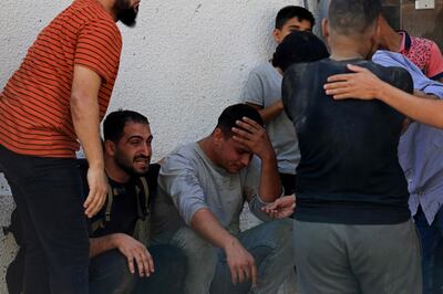 People mourn the death of Palestinians killed in the latest violence between Israel and Hamas. AFP